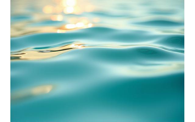 A detailed shot of water ripples, symbolizing soothing relief and gentle movement for pain therapy.
